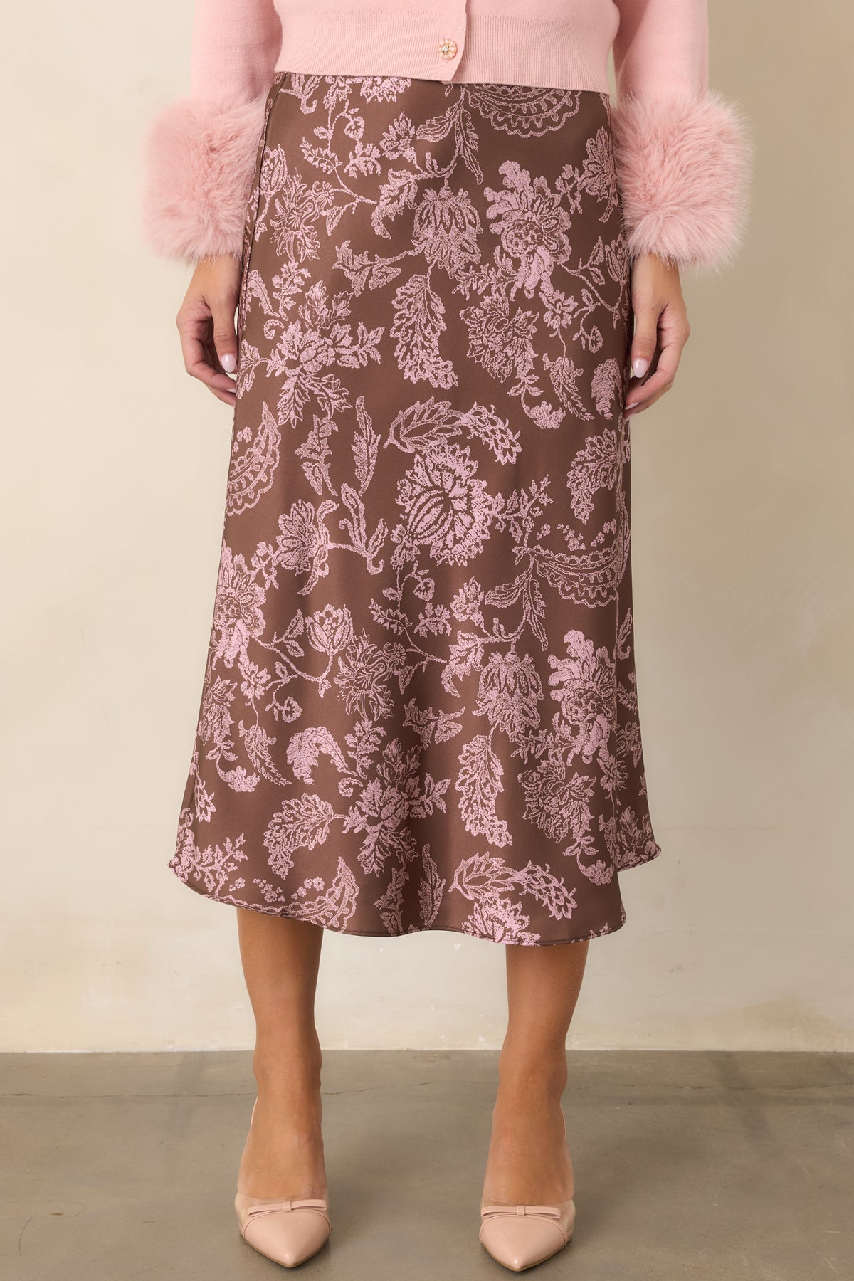 Mocha brown satin skirt highlighting the delicate pink floral and leafy vine print.