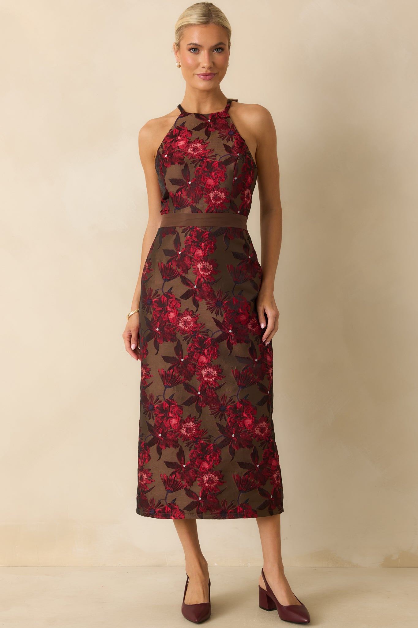 Mocha jacquard dress highlighting its elegant halter neckline and smooth, fitted waistline.
