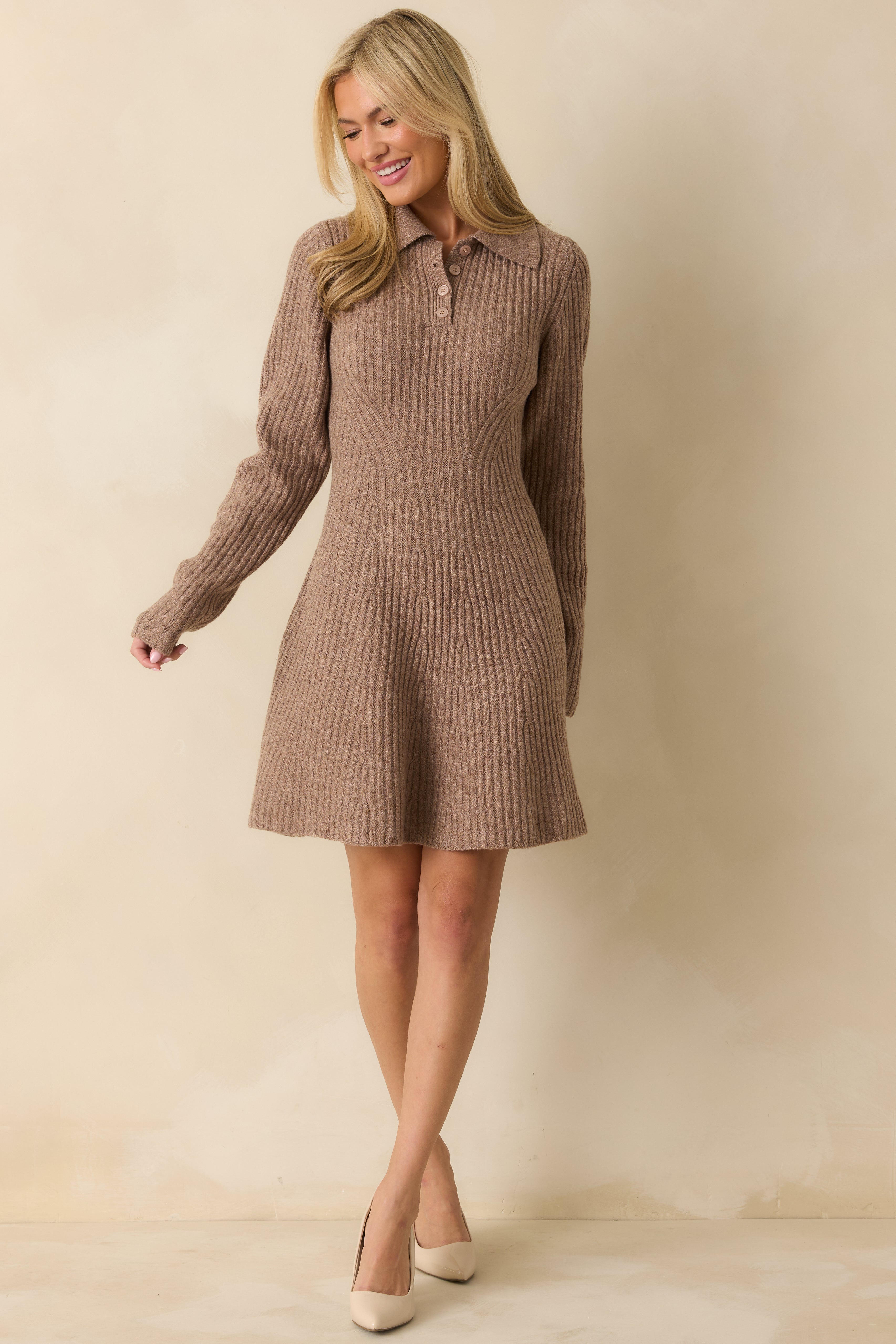 Mocha brown knit dress with partial button front, fitted torso, and flared hem for a flattering silhouette.