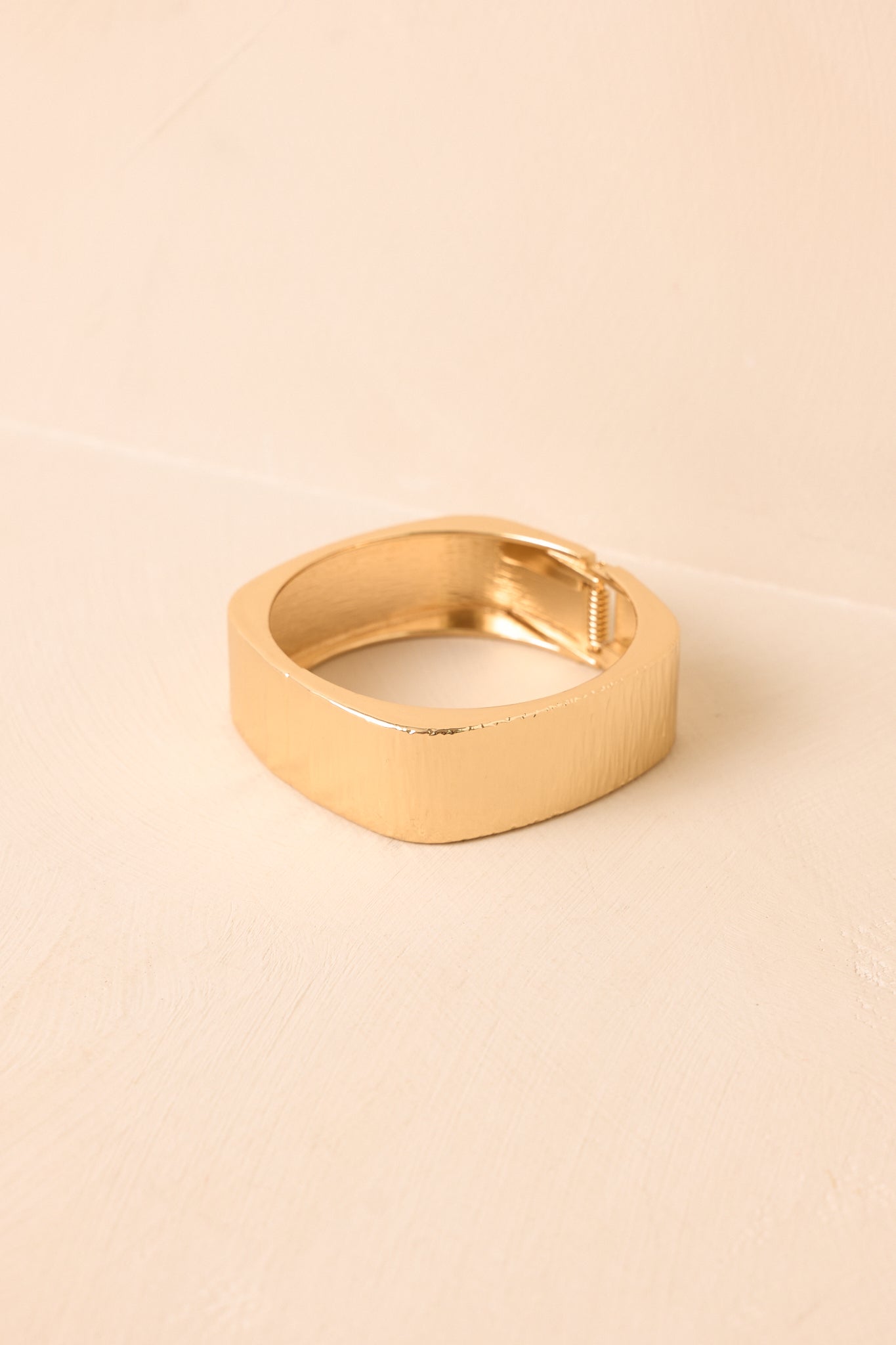 Statement cuff bracelet displayed against a neutral background, highlighting the wide shape, clean edges, and modern sculptural design.