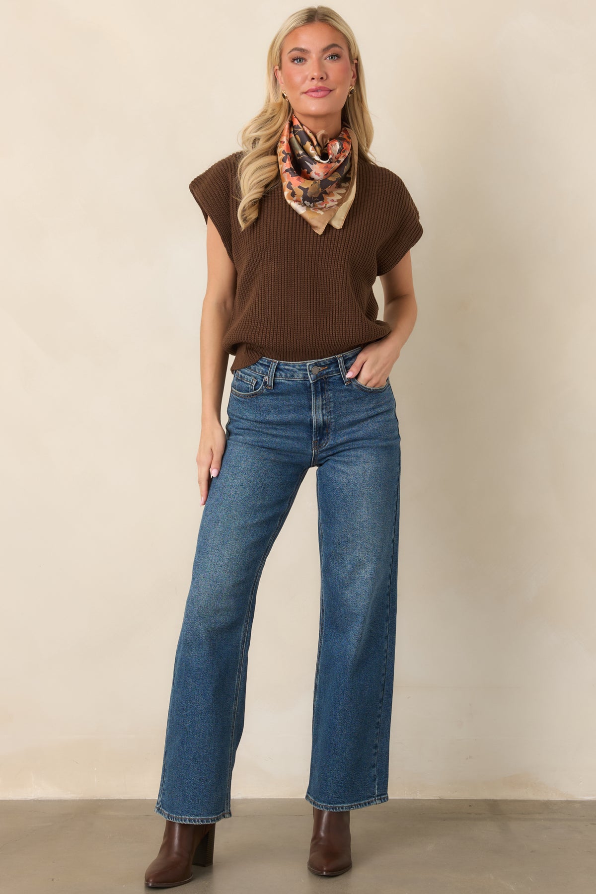 Modern ribbed top with slightly extended shoulders, a relaxed bodice, and structured mock neckline.