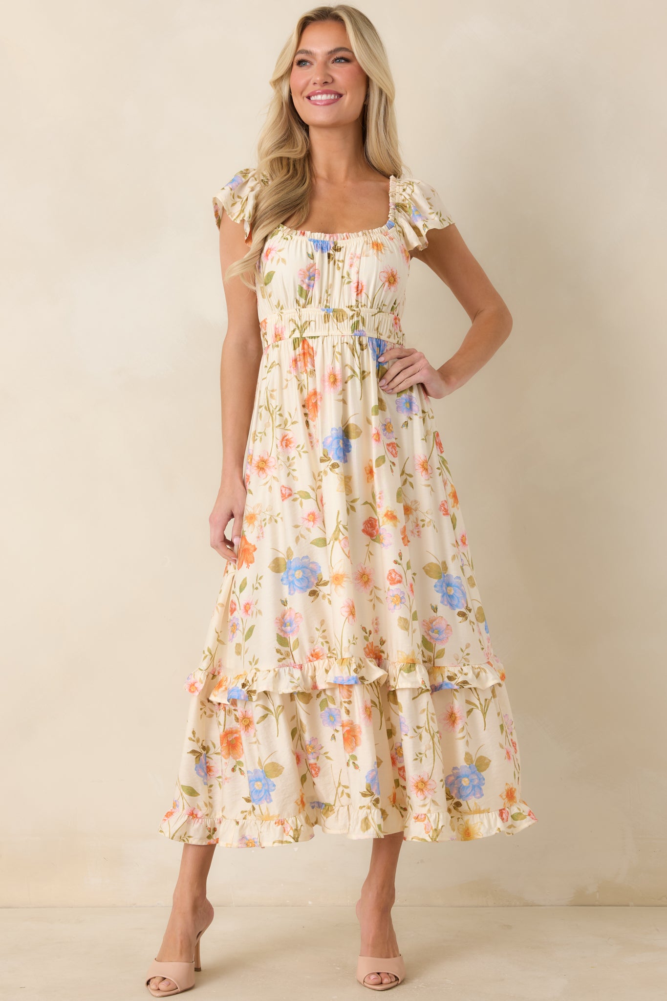 Multi floral midi dress with gathered bust and flowing tiered skirt for soft movement.