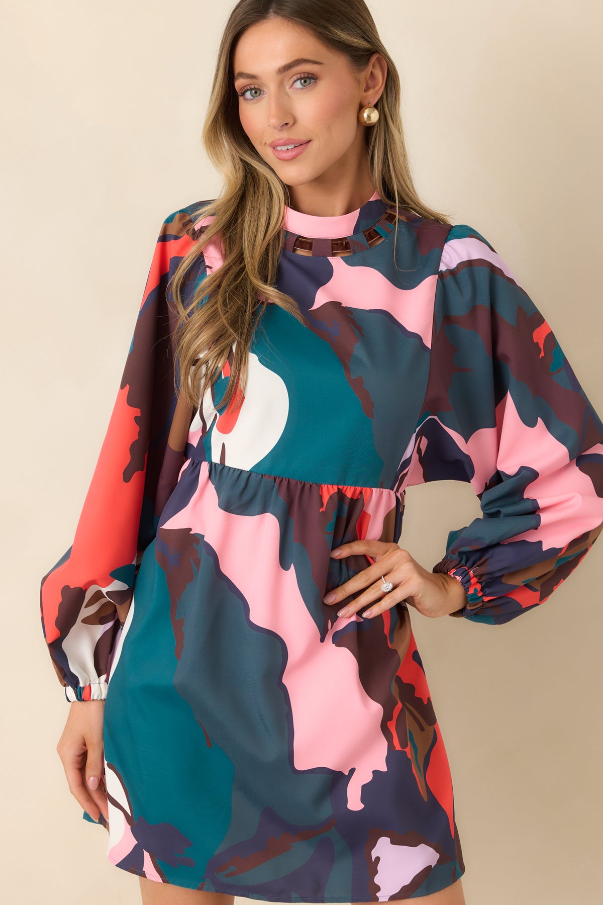 Long balloon sleeves gather into elasticized cuffs on the multicolor A-line mini dress.