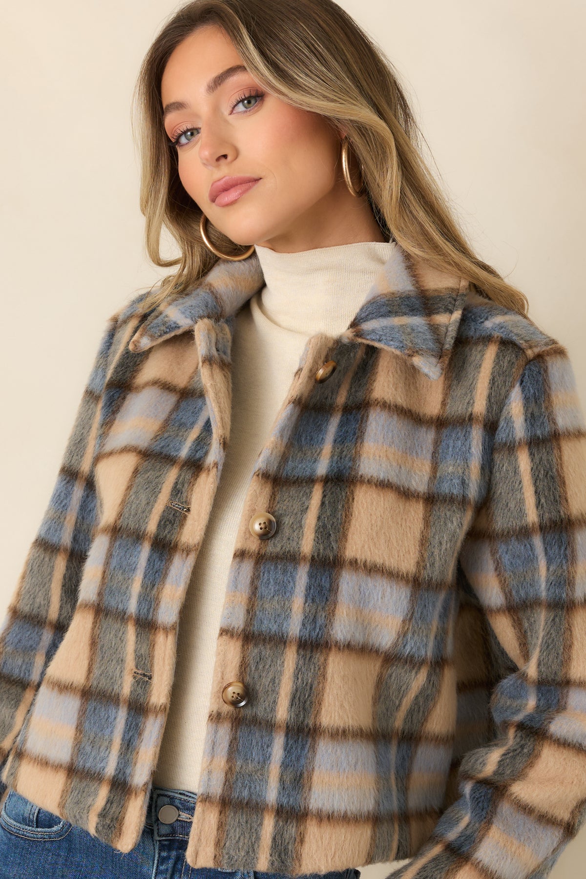 Cropped hem and tailored lines give the multicolor jacket a polished silhouette.
