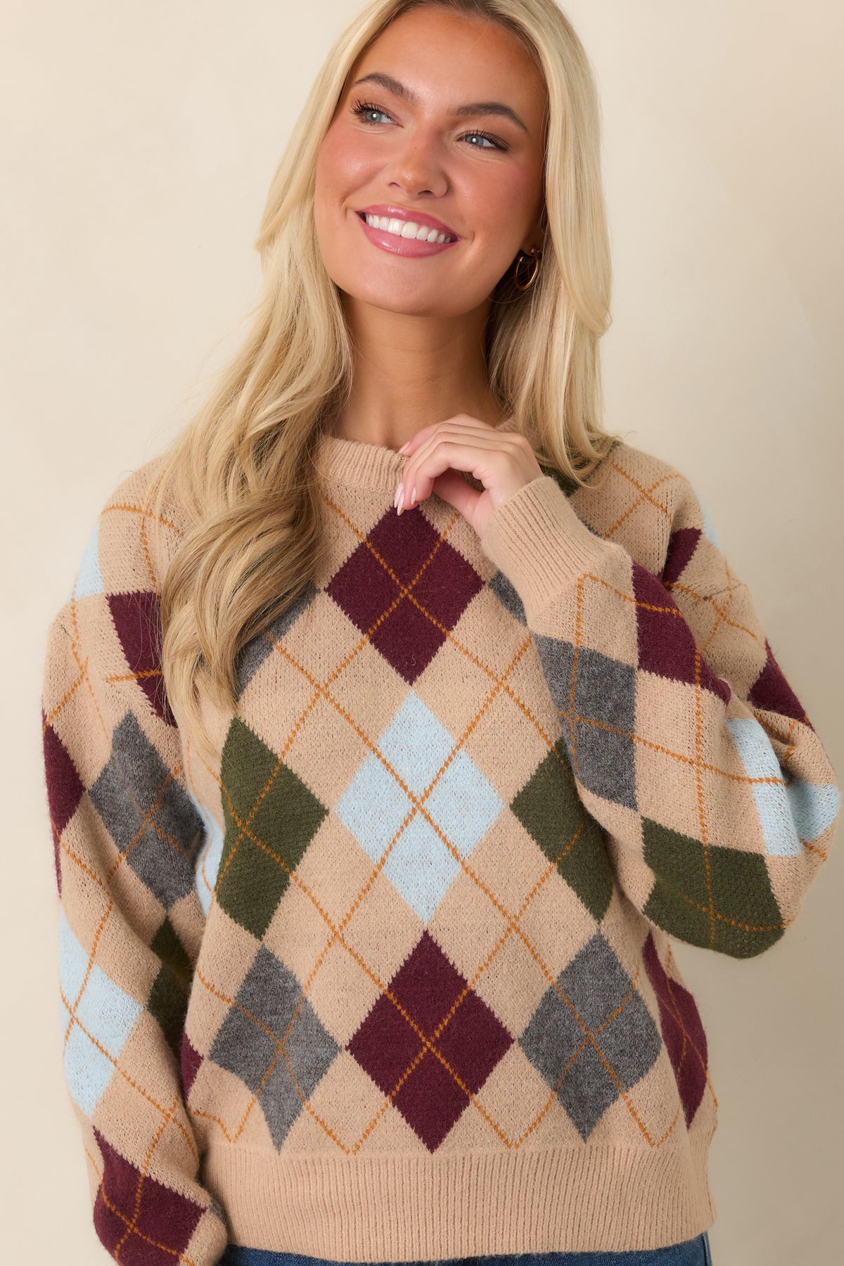 Detailed view of the multicolor diamond knit pattern featuring burgundy, olive, grey, light blue, and golden accents.