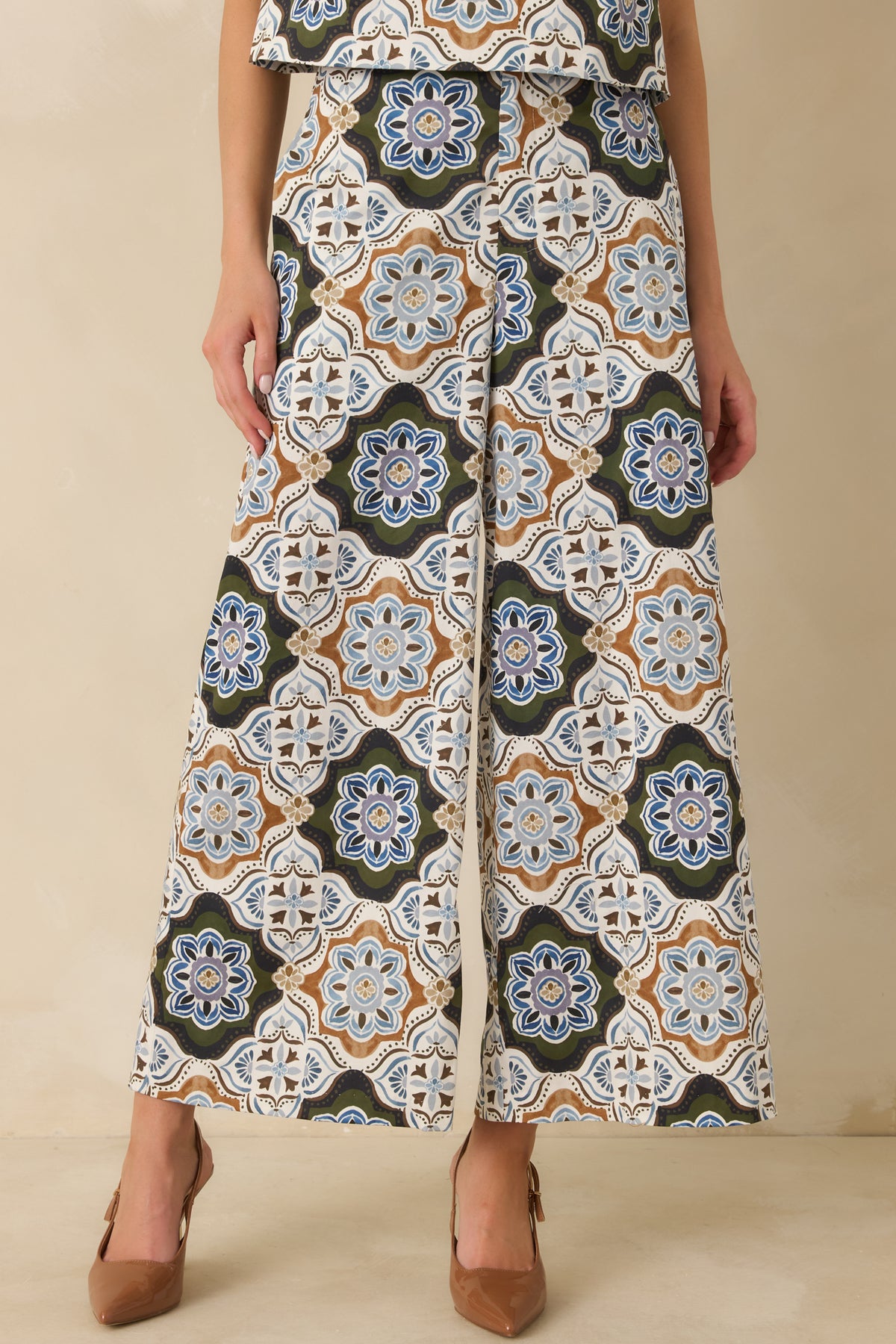 Multicolor medallion print pants showcasing the ornate pattern and practical roomy side pockets.