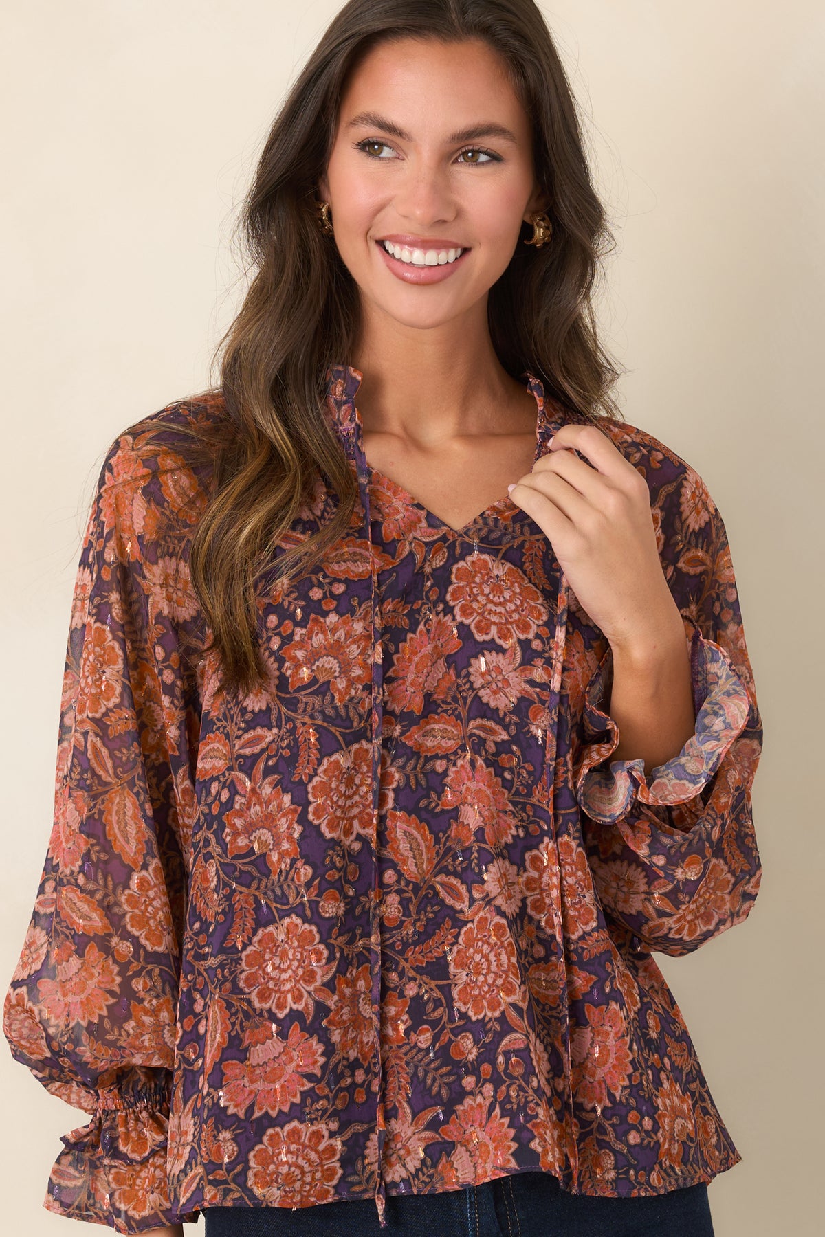 Multicolor floral top featuring a sheer outer layer over a lined bodice for coverage.