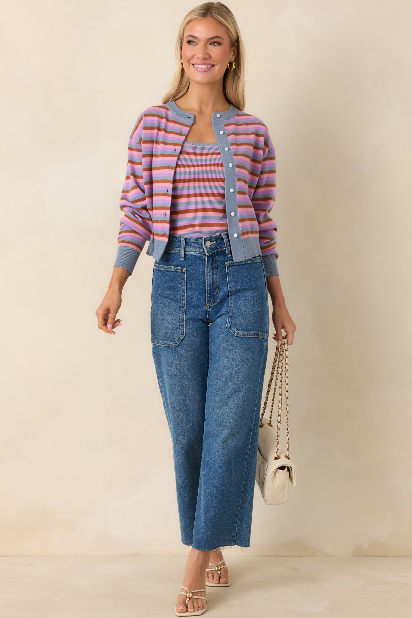 Multicolor striped cardigan with ribbed trim and classic silhouette.