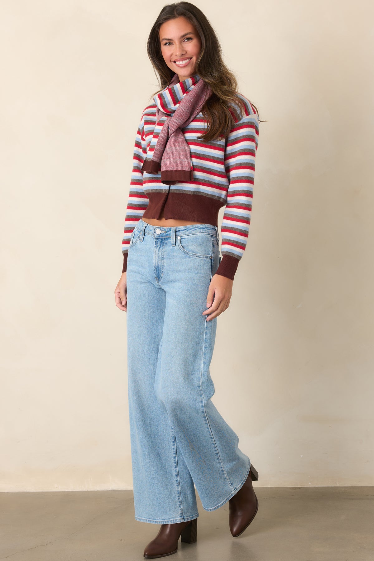 Multicolor striped cardigan combines dropped shoulders and a button-front closure with contrasting brown ribbed trim.