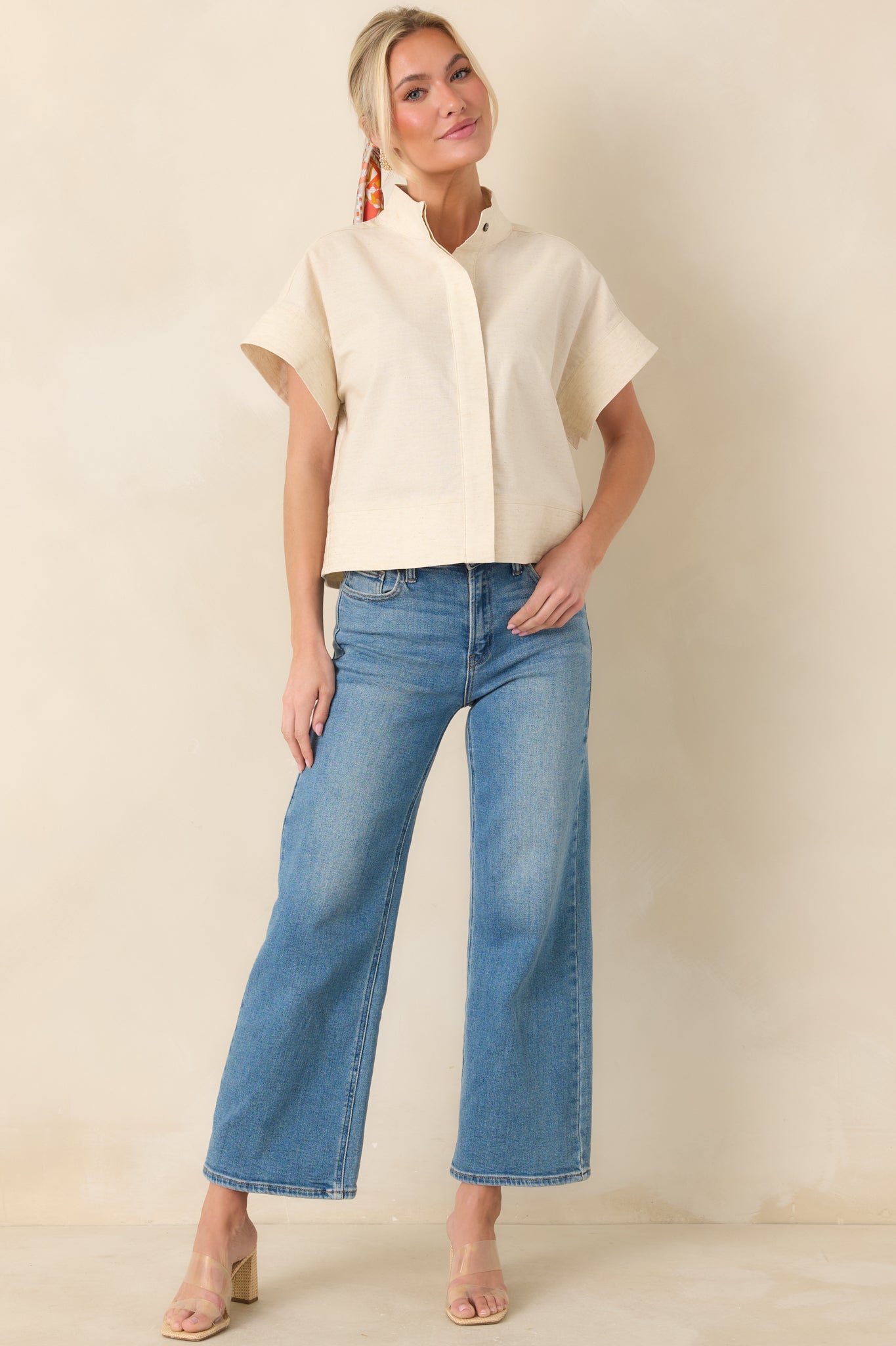 Natural cotton linen blend top with boxy silhouette and polished mock neckline.
