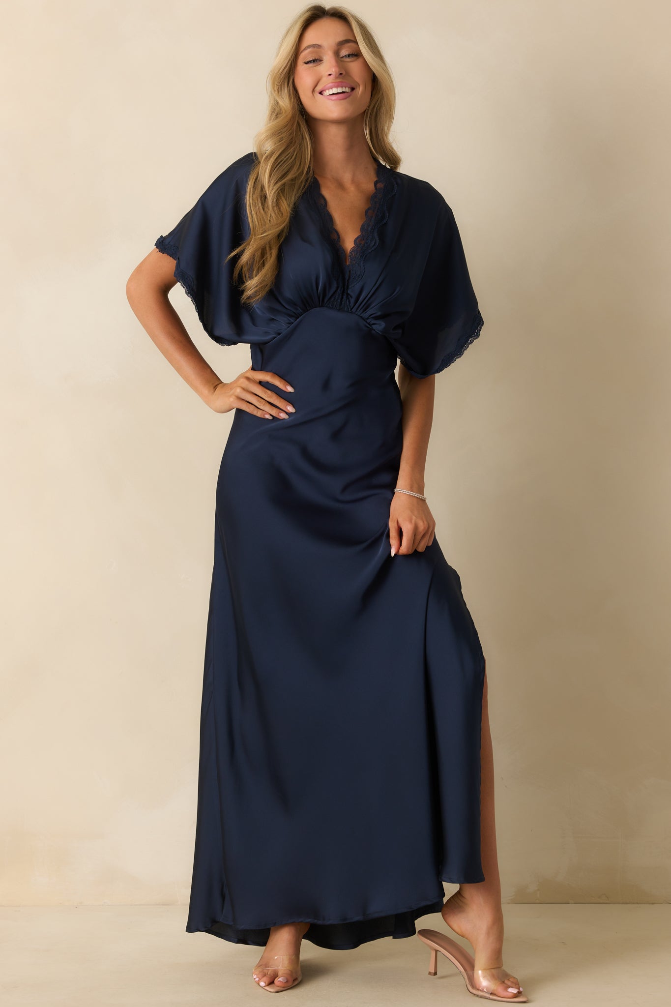 Navy dress showcasing a relaxed silhouette with delicate lace accents.