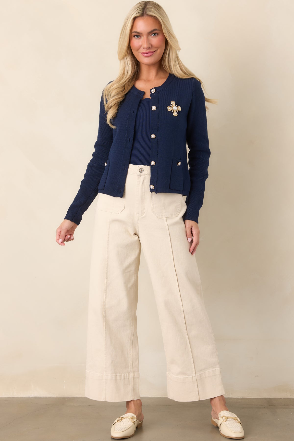 Classic navy ribbed tank featuring delicate scalloped edging, a fitted shape, and comfortable stretch construction.