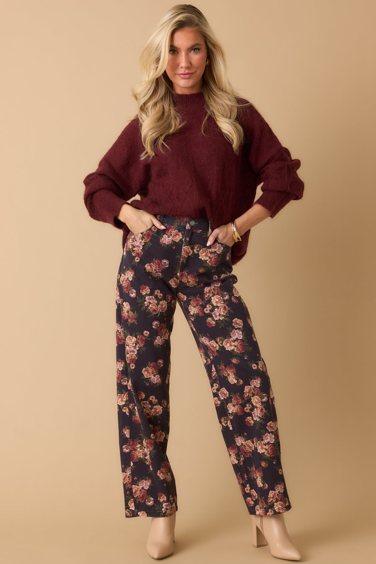 Navy floral jeans featuring a high-rise waist, functional pockets, and a clean straight-leg silhouette.