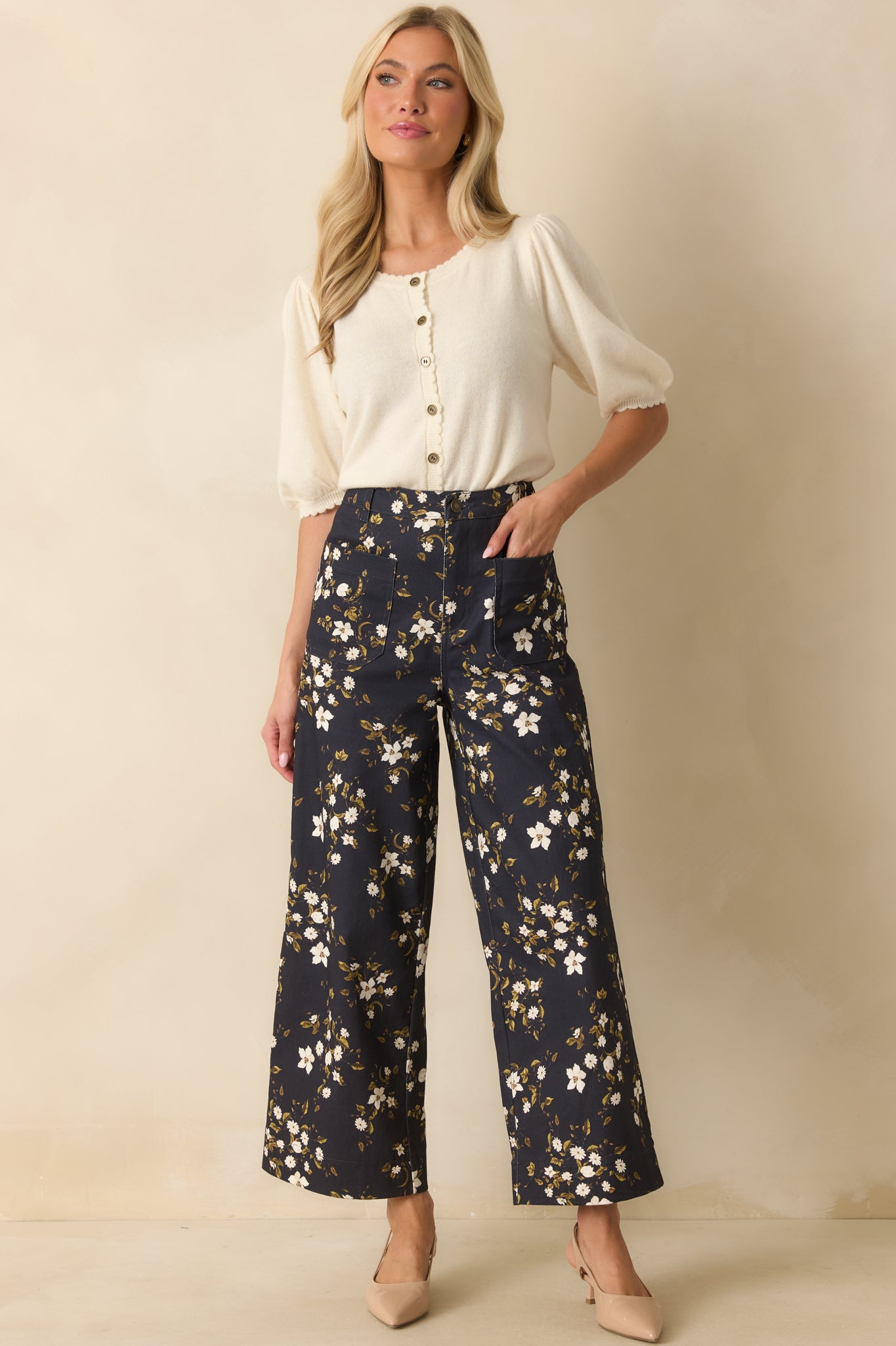 Floral patterned jeans in deep navy with functional pockets, belt loops, and a zip fly closure.
