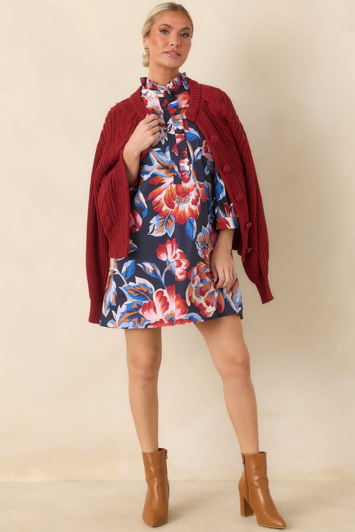 Navy floral mini dress featuring a relaxed silhouette, colorful oversized floral print, and three-quarter length sleeves.