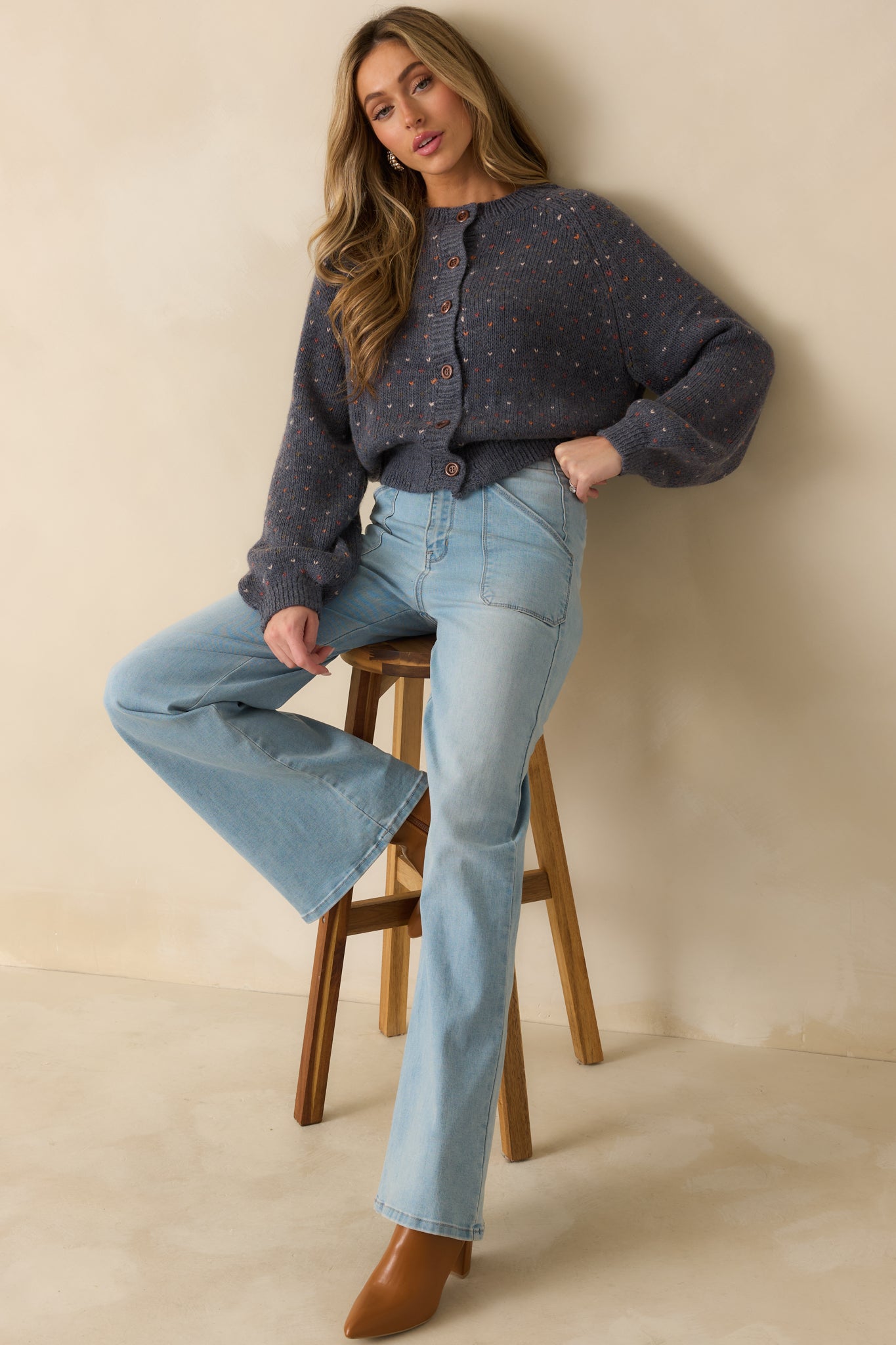 Front-facing navy heather cardigan highlighting the relaxed fit, ribbed trim, and long sleeves.