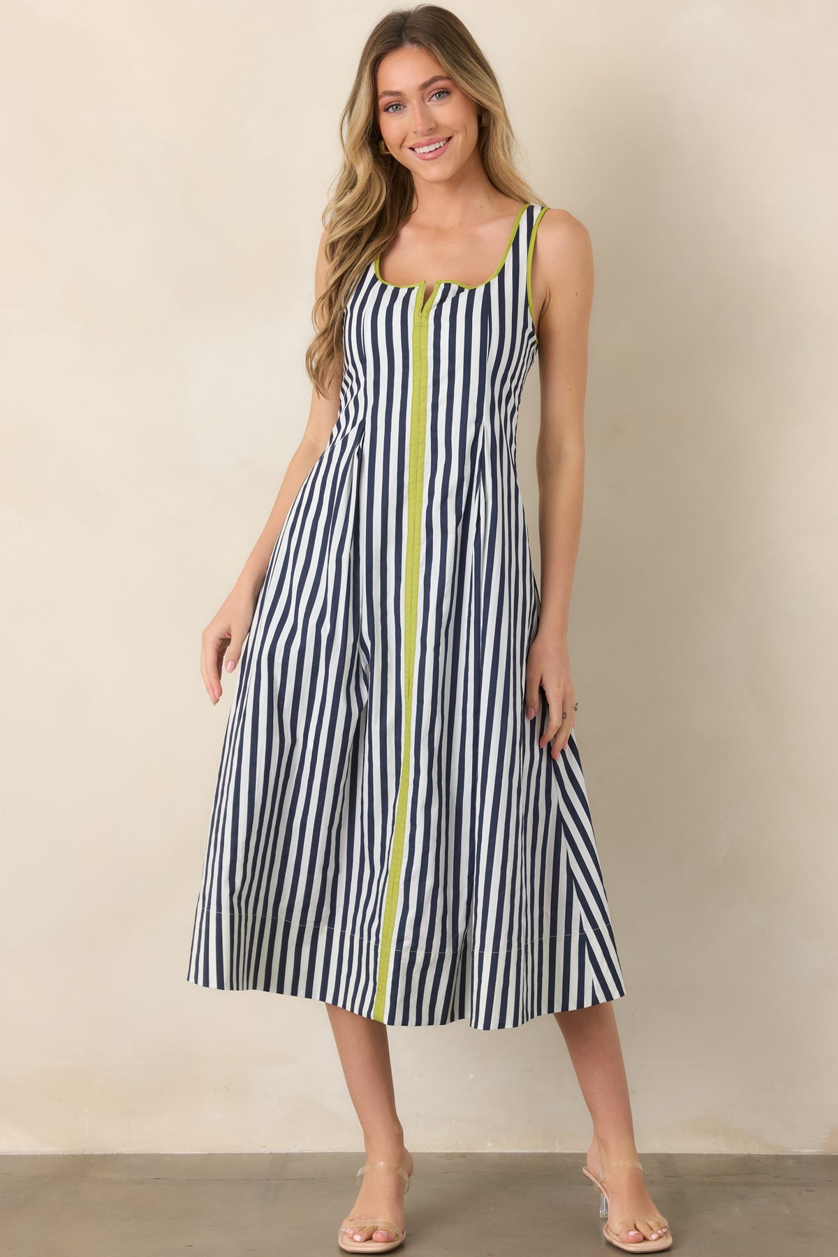 Navy and ivory striped cotton midi dress featuring eye-catching chartreuse accents, a softly rounded square neckline, and an easy, flowing skirt.