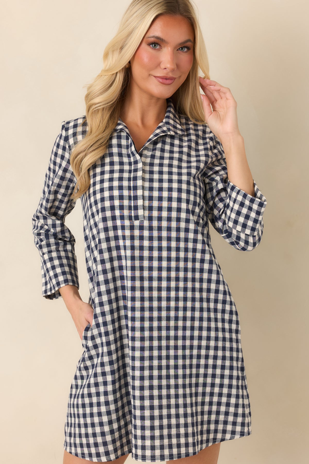 Relaxed A-line skirt offers an easy silhouette in navy and ivory gingham with discreet side pockets.