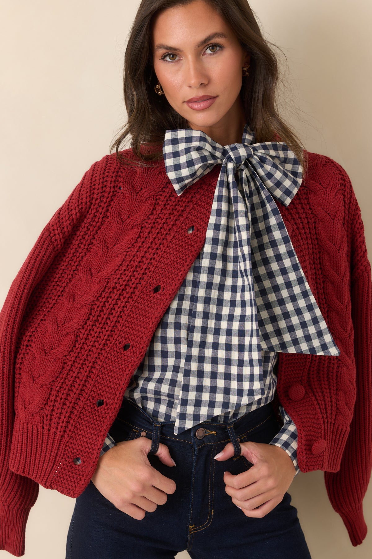 Navy and ivory gingham blouse showcasing the oversized neck tie and concealed front button placket.