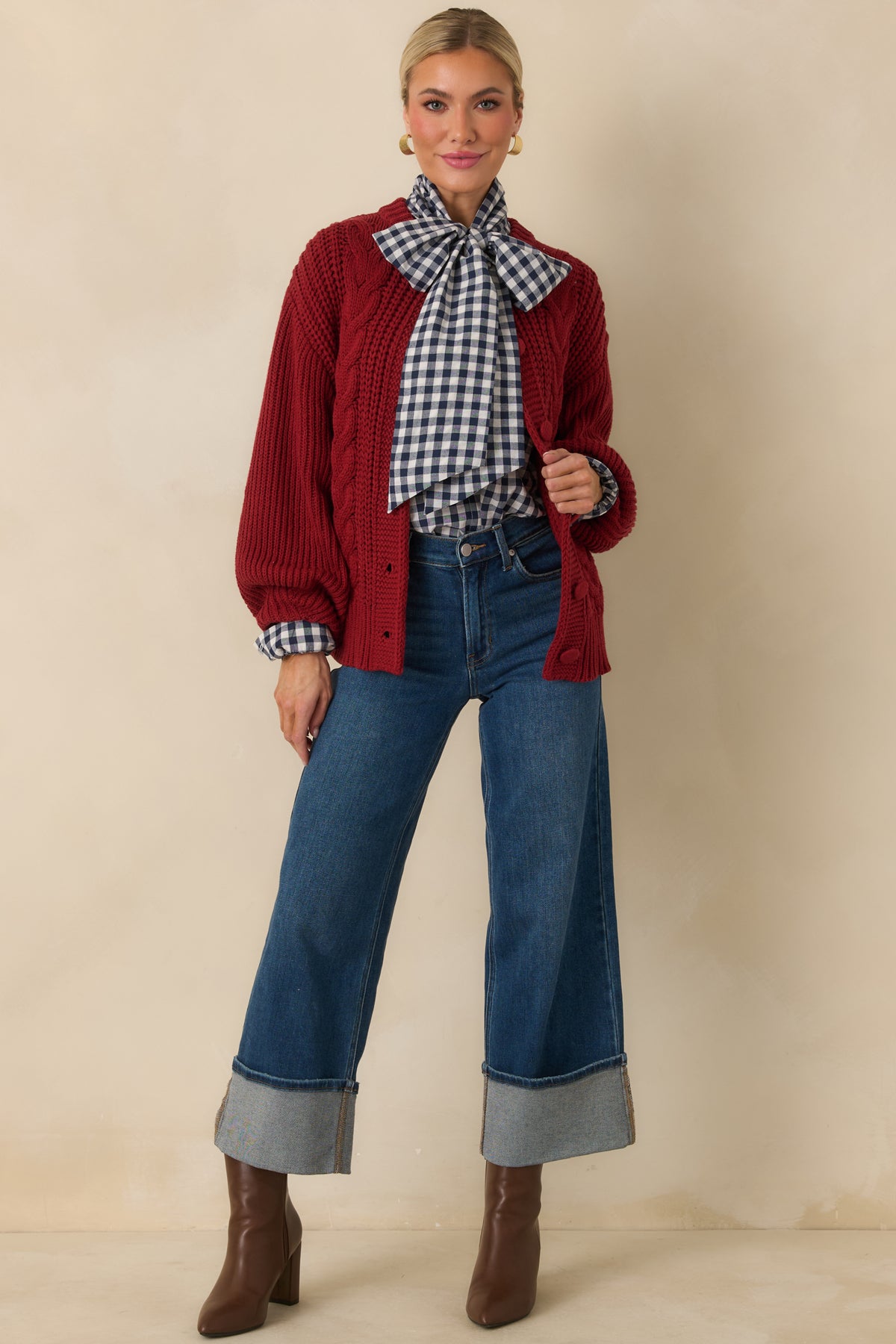 Navy and ivory gingham blouse with a relaxed silhouette, long sleeves, and an oversized statement neck tie.