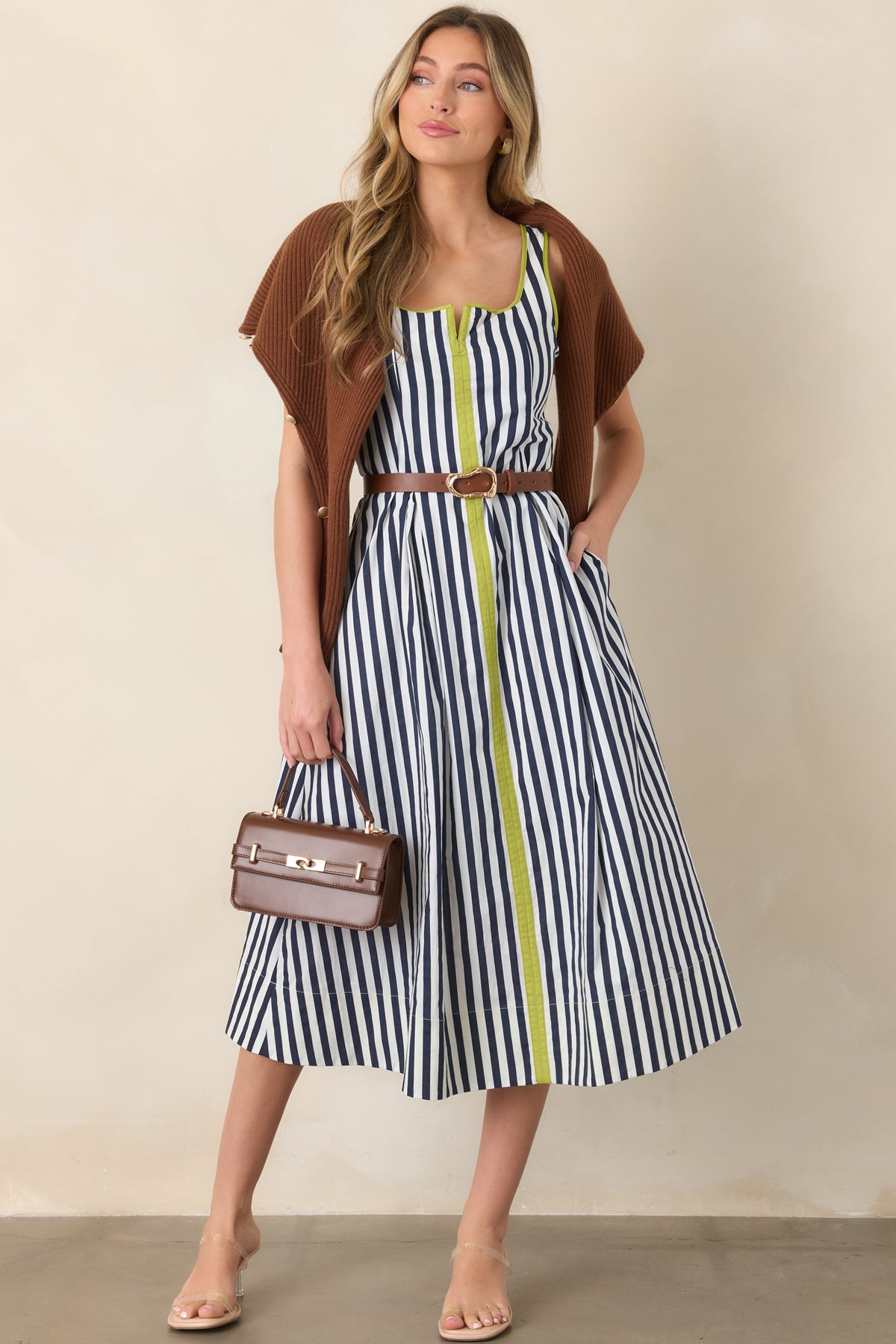 Classic striped midi dress with navy and ivory bands, vibrant chartreuse edging, a softly squared neckline, and an easy flowing skirt.
