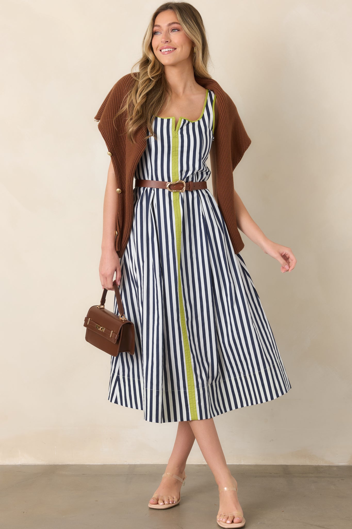 Navy and ivory striped cotton midi dress featuring bold chartreuse trim, a rounded square neckline, relaxed skirt, and practical side pockets.