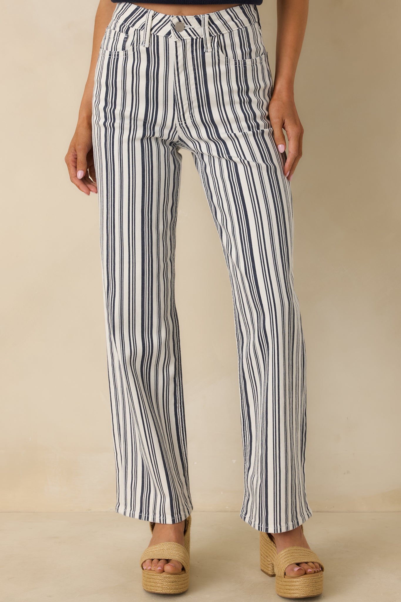 Navy pants focusing on the wide-leg silhouette and woven cotton-blend fabric texture.