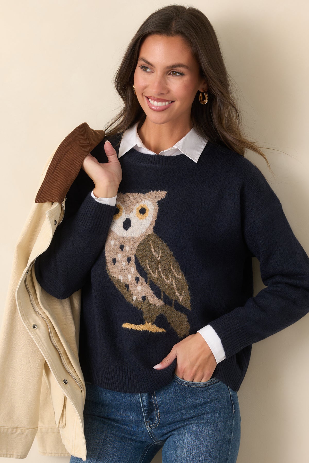 Deep navy pullover featuring a whimsical owl design beneath a ribbed crew neckline.