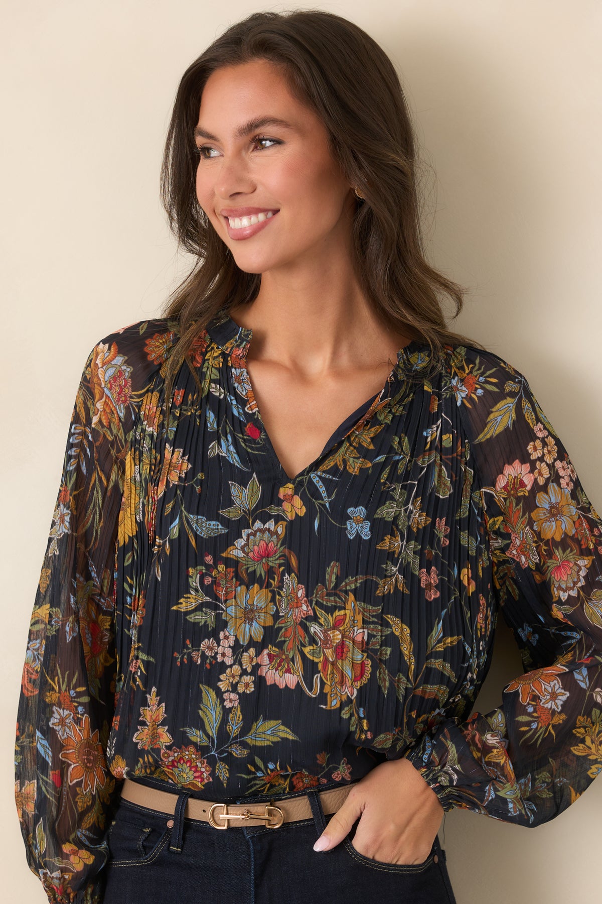 Close view of the warm rust, camel, pink, blue, and olive botanical print against the deep navy base.
