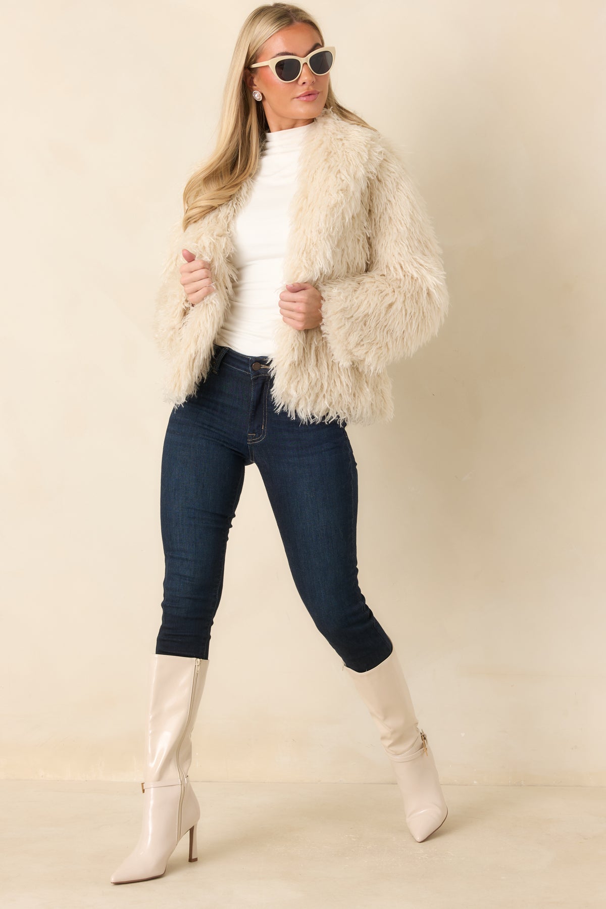 Neutral plush jacket with a dimensional shaggy texture, open front, and softly relaxed sleeves.