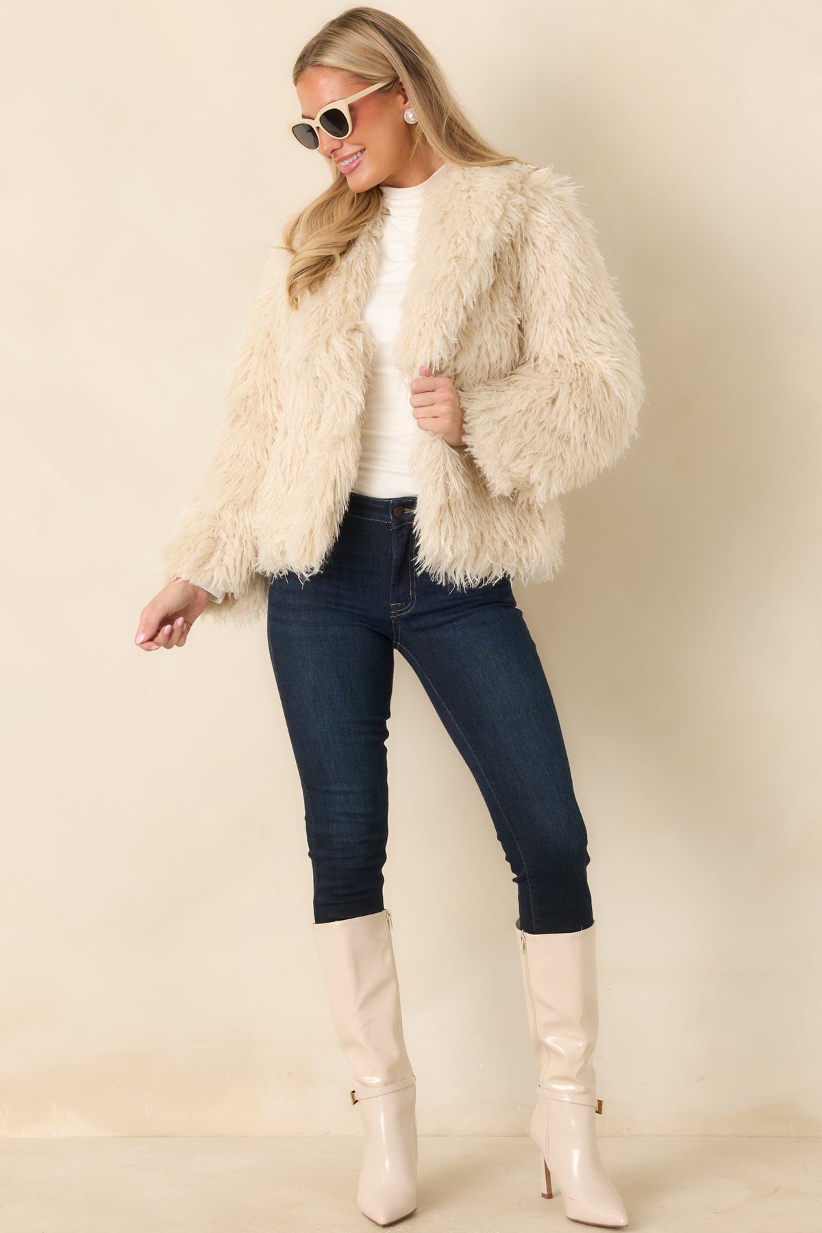 Textured neutral jacket featuring a soft, shaggy finish, relaxed fit, and long sleeves.