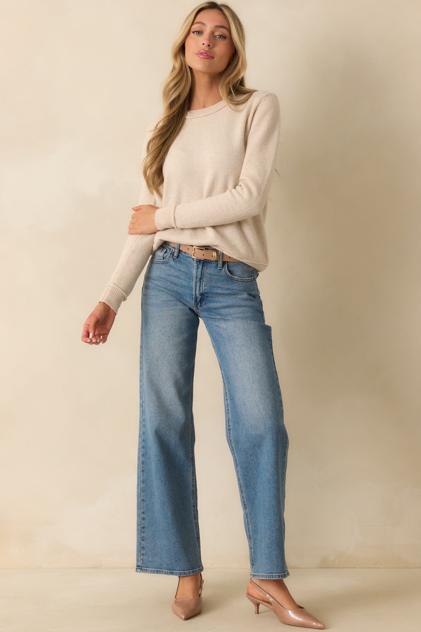 Oatmeal beige sweater with a crew neckline, long sleeves, and relaxed fit.