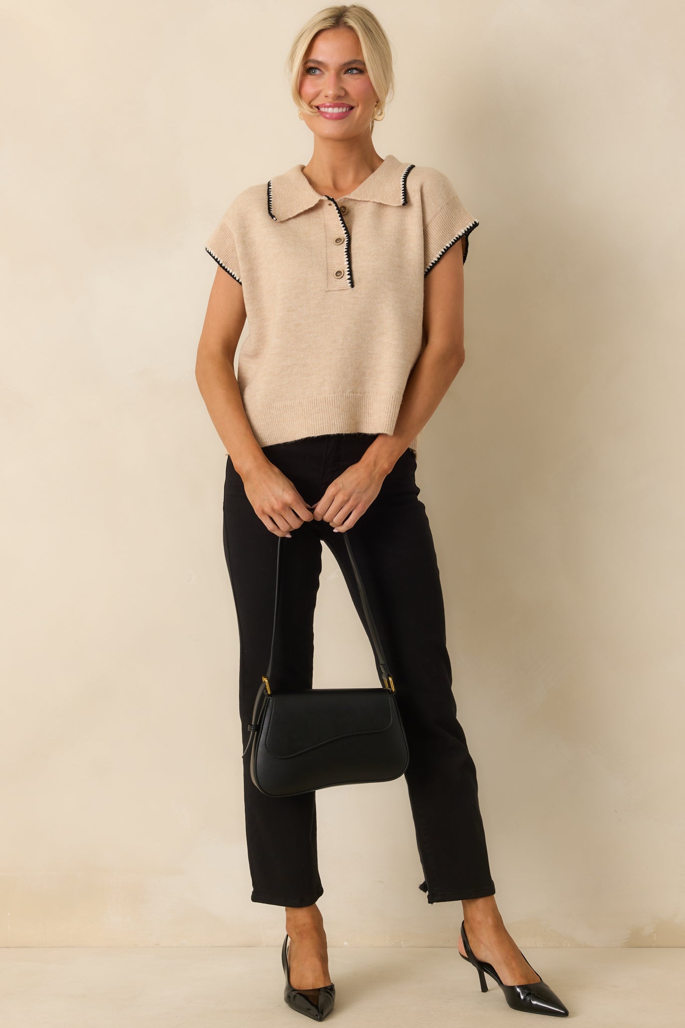 Oatmeal beige top with collared neckline, short cap sleeves, and relaxed fit.