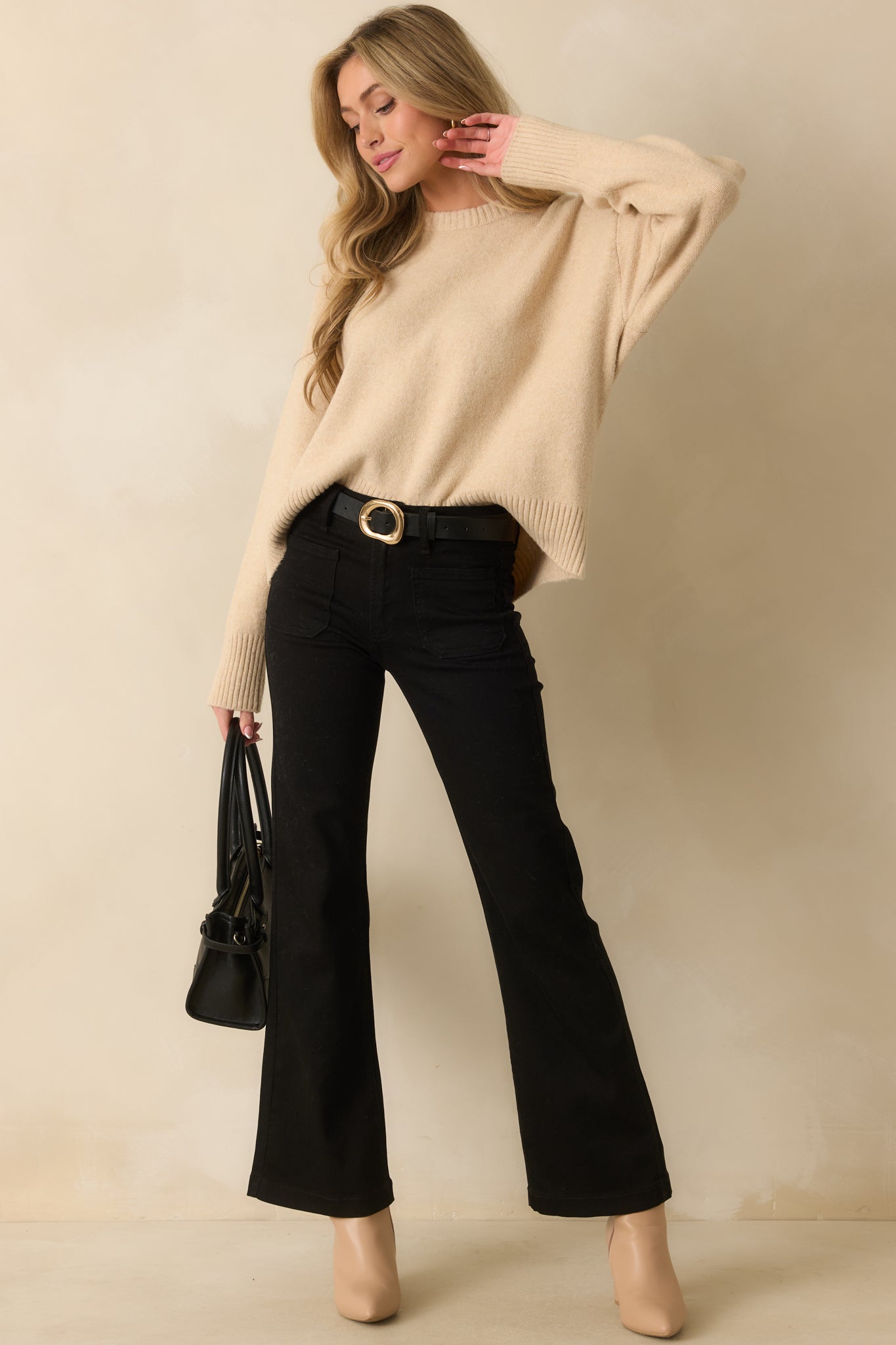 Full body front view emphasizing the neutral beige tone and classic crew neck design.