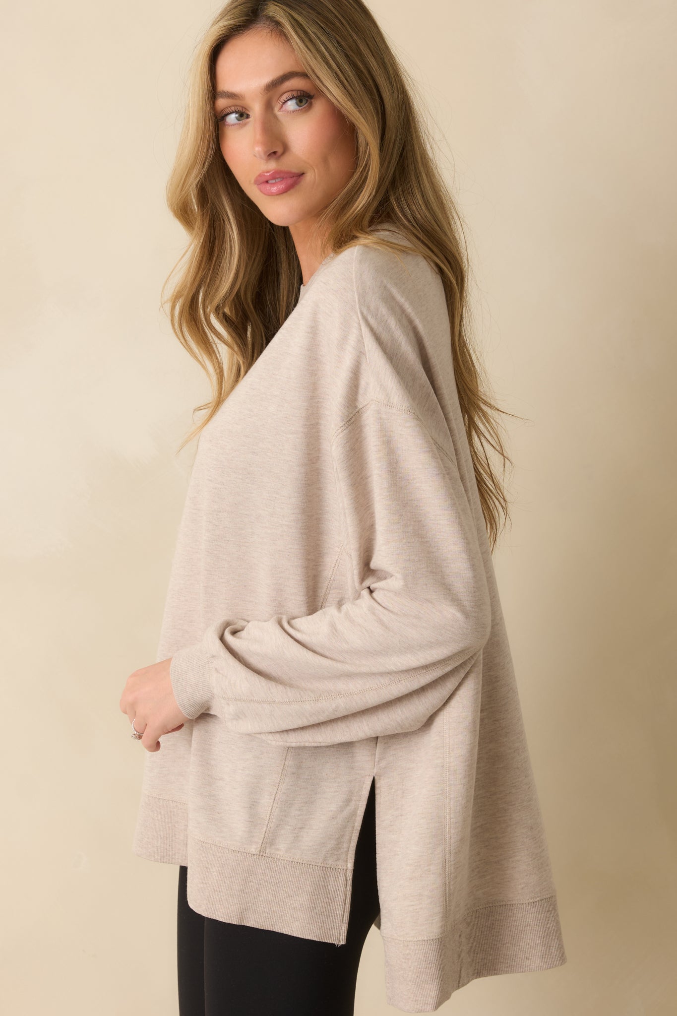 Front-facing sweatshirt showing the high-low hem and side slits for easy layering