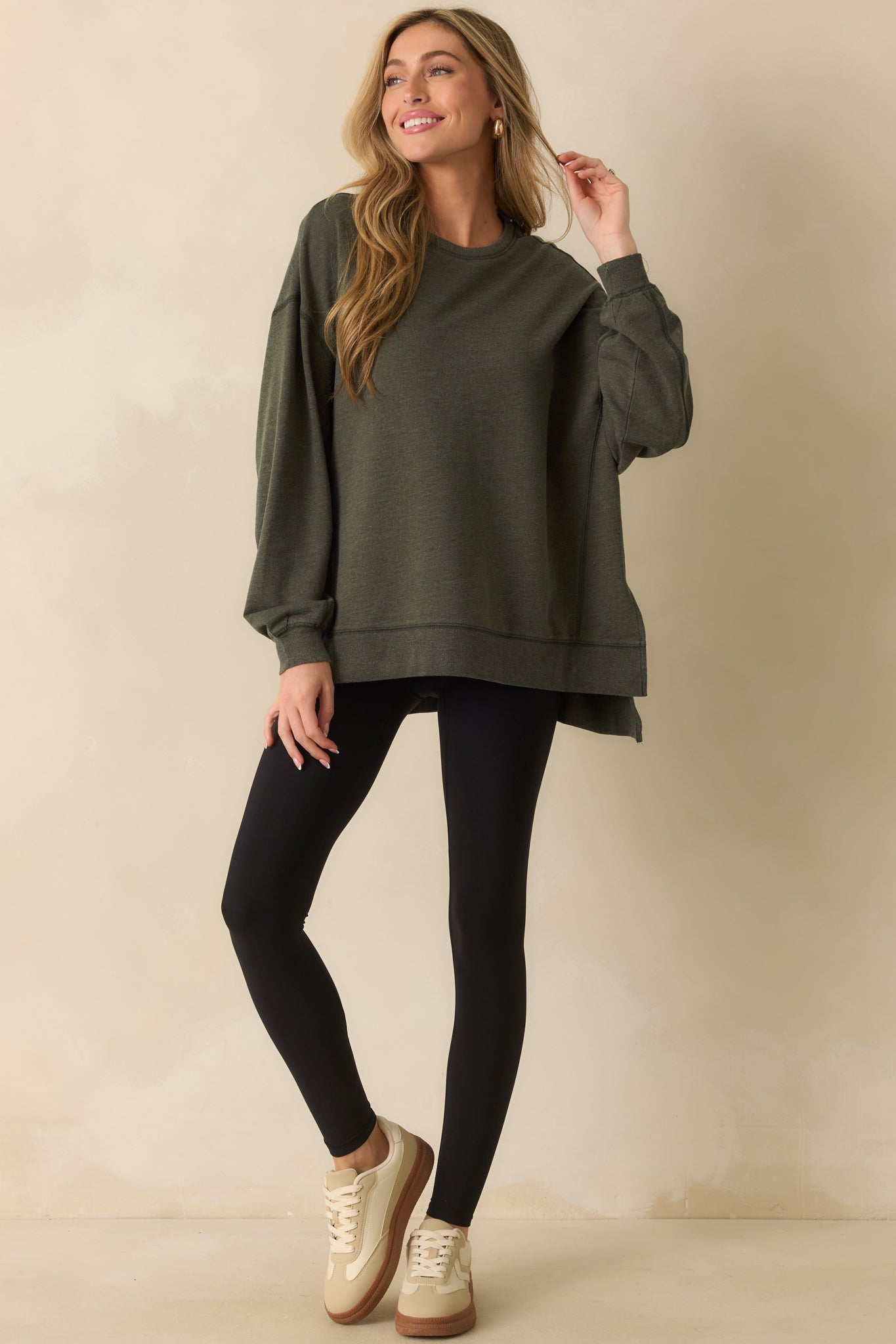 Full body front view showcasing the soft cotton-blend fabric and high-low hem design.