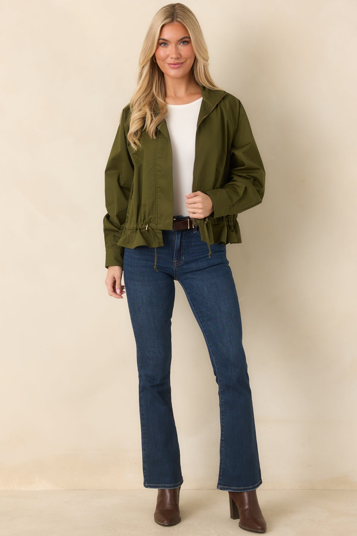 Dark wash denim jeans with a high-rise waist, slight flare leg, and classic five-pocket styling.