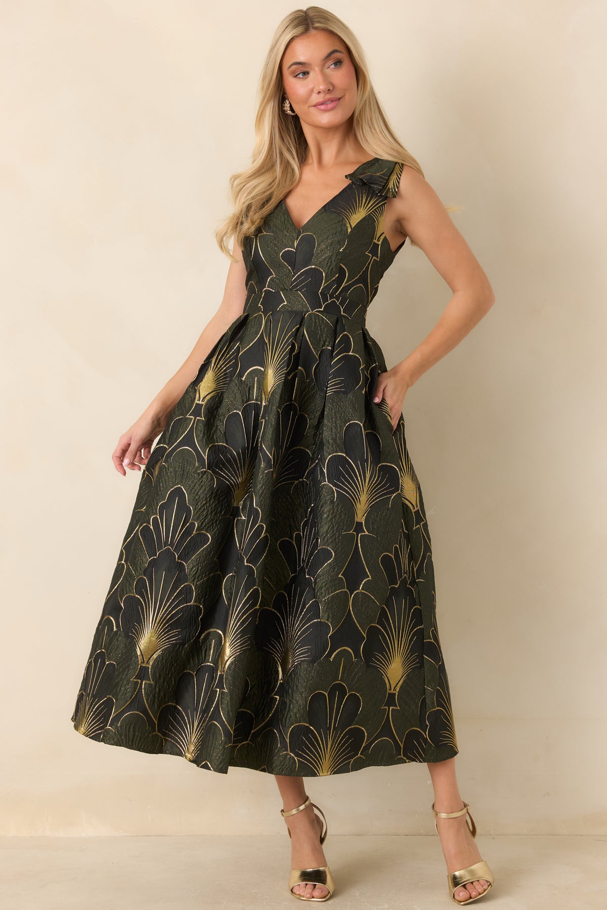 Olive midi dress with a floral jacquard pattern, gold accents, and a flattering V-neckline.