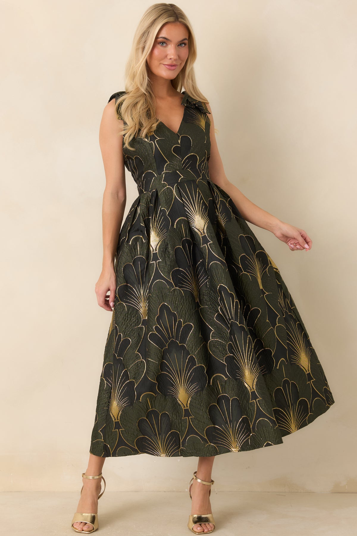Olive floral midi dress with an intricate woven pattern and a gracefully gathered skirt.
