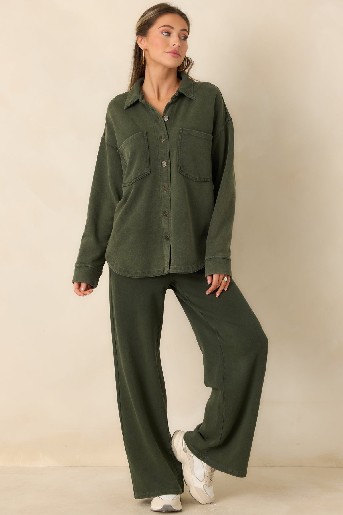 Olive French terry pants featuring an adjustable drawstring waist and practical side pockets.