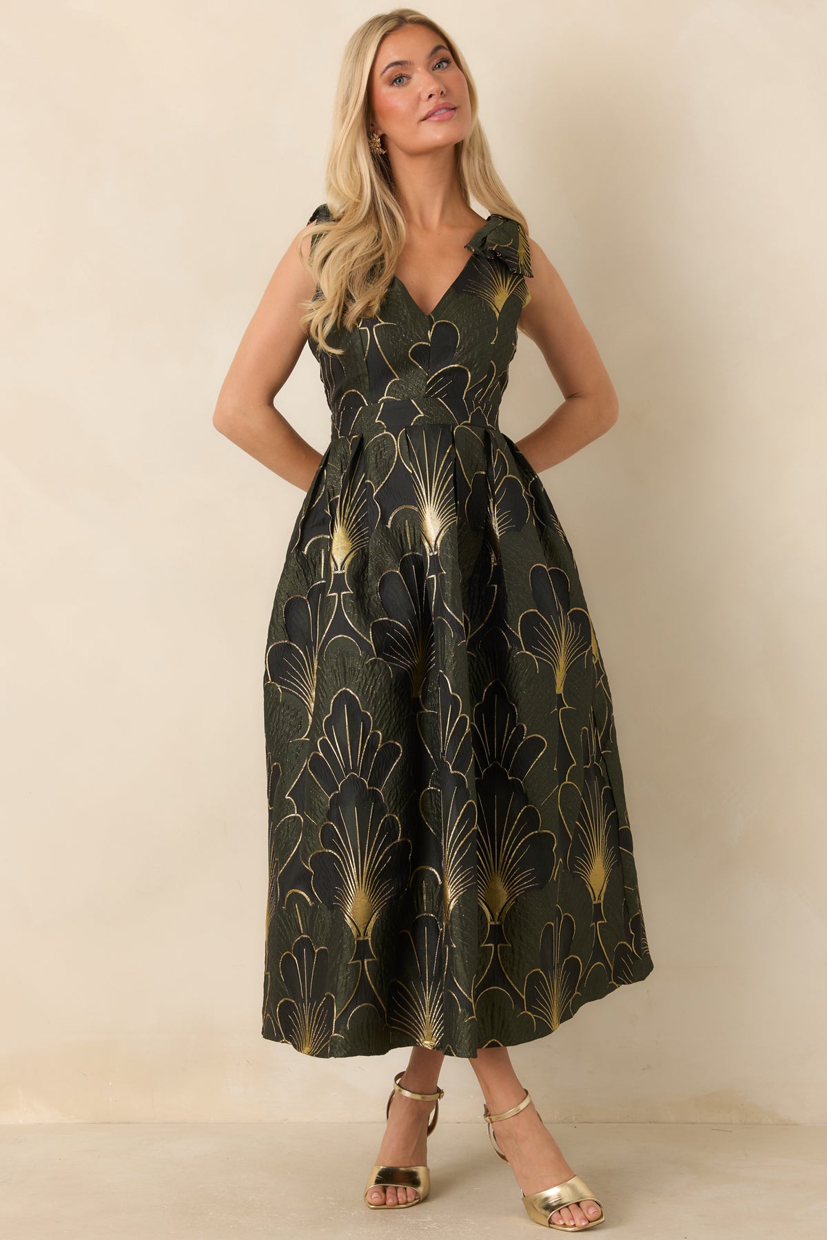 Floral jacquard midi dress with shimmering gold details and a softly flared silhouette.