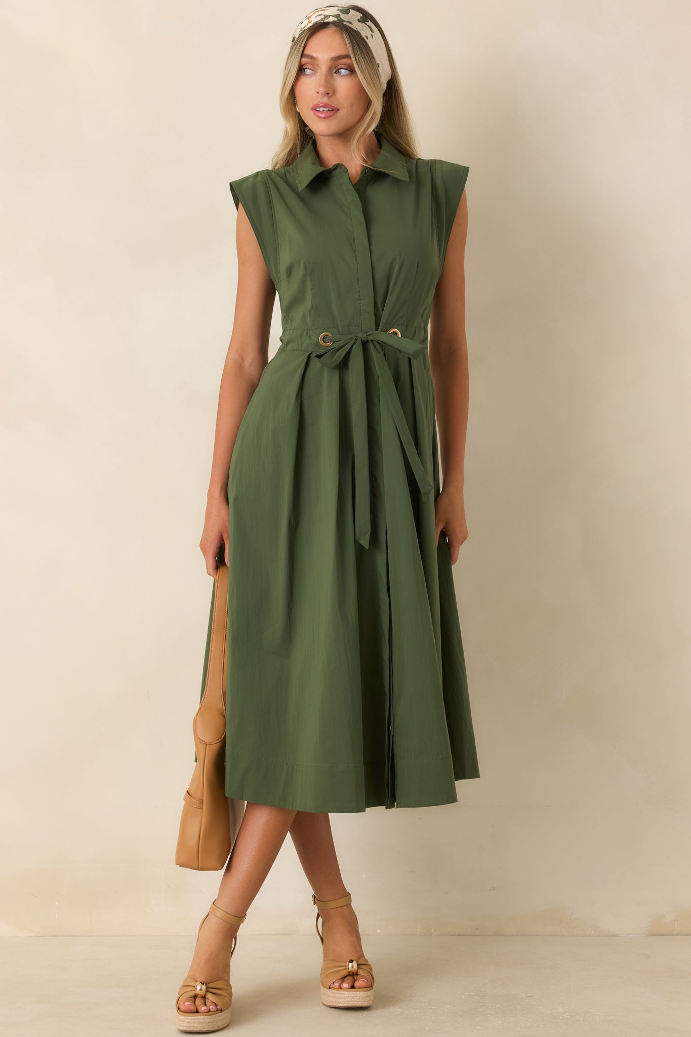 Relaxed yet refined olive green dress with a collared neckline, full skirt, and versatile poplin construction.