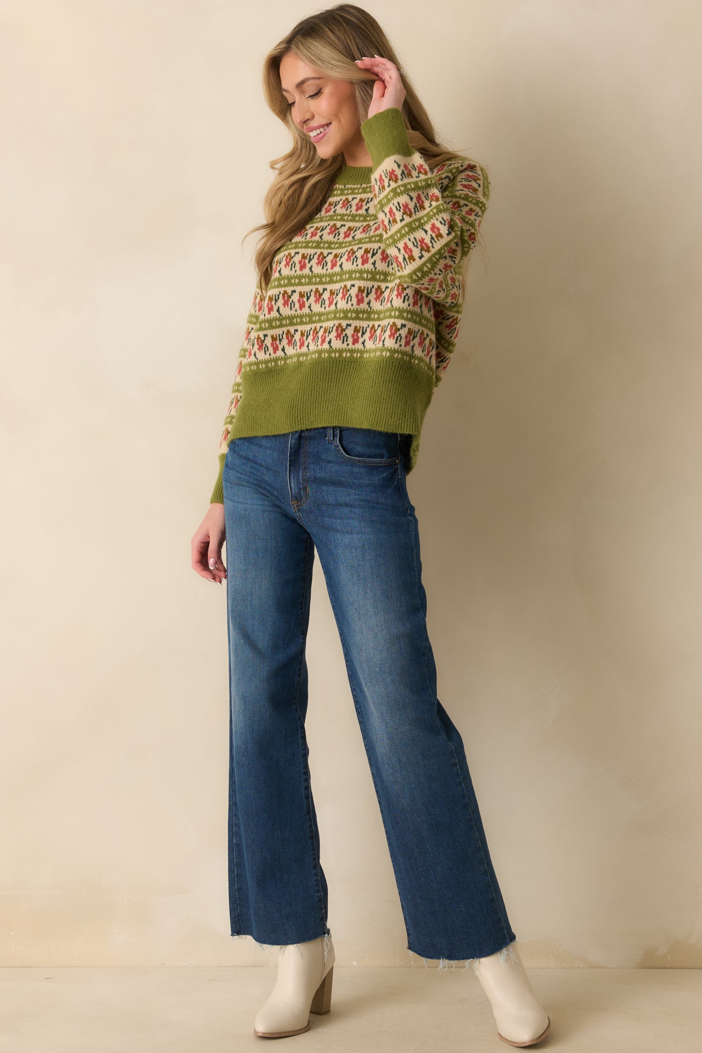 Crewneck sweater in olive green with ivory, rust, and green Fair Isle details for a timeless winter look.