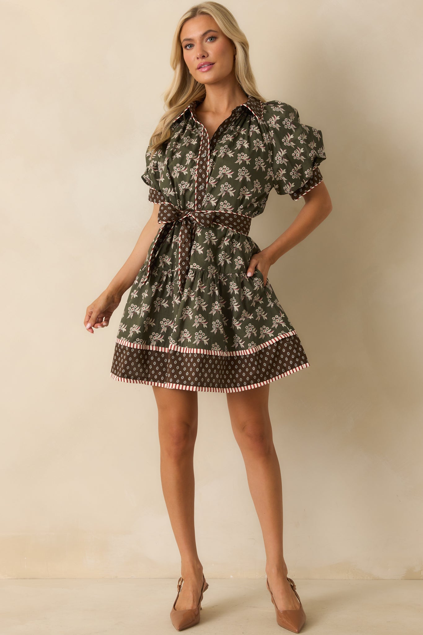 Olive green floral mini dress with collared neckline, short puff sleeves, and optional self-tie belt.