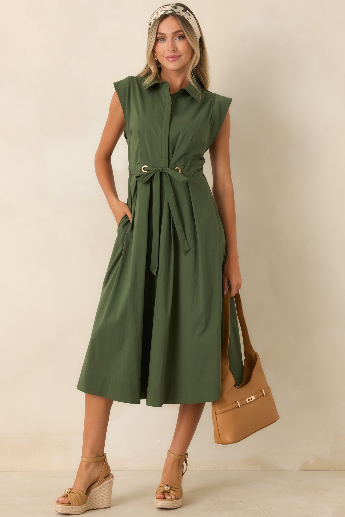 Olive green cotton poplin midi dress featuring a collared neckline, cap sleeves, concealed buttons, and a belted fit-and-flare silhouette.