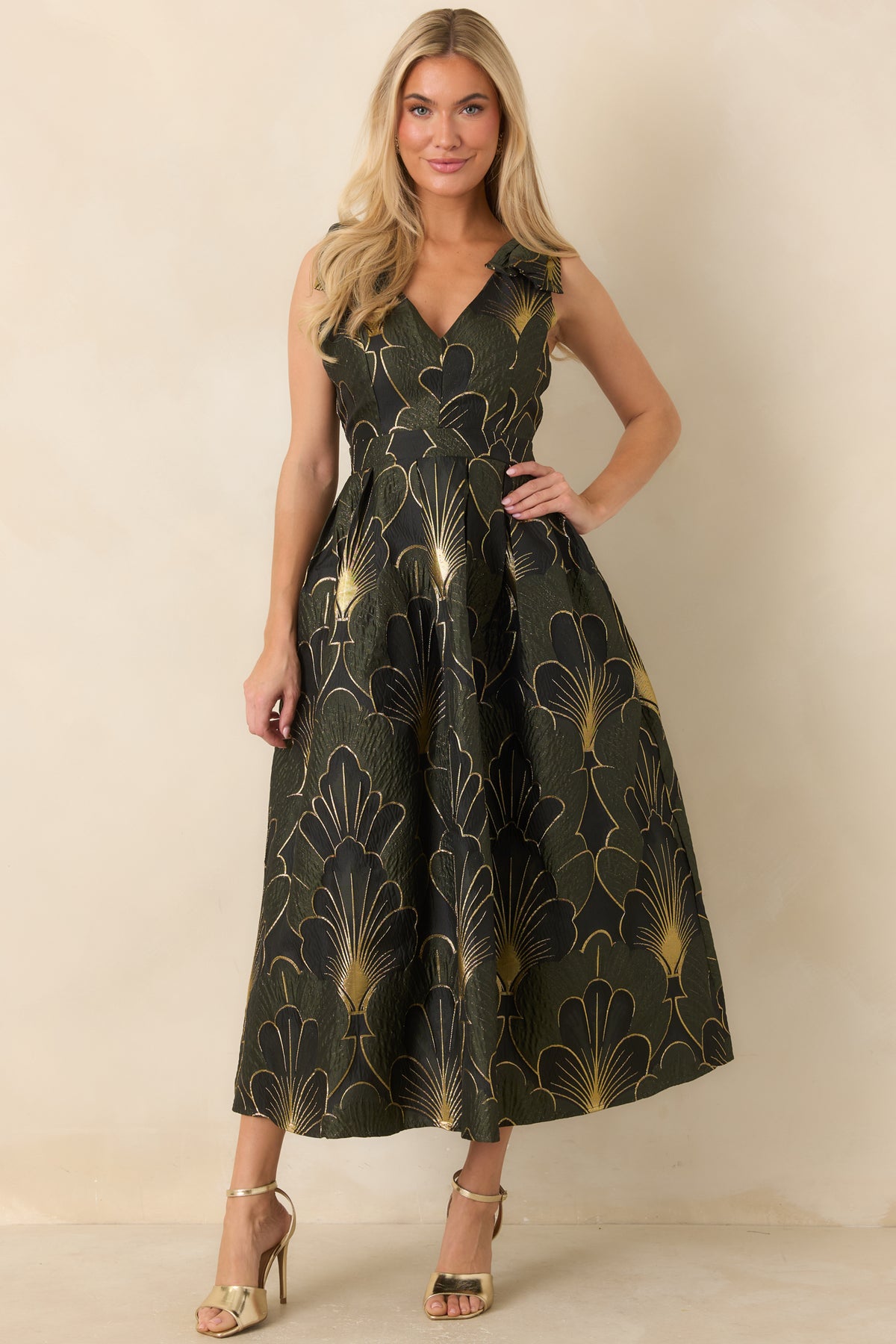 Elegant olive dress with shimmering jacquard florals, a fitted bodice, and a full midi hem.