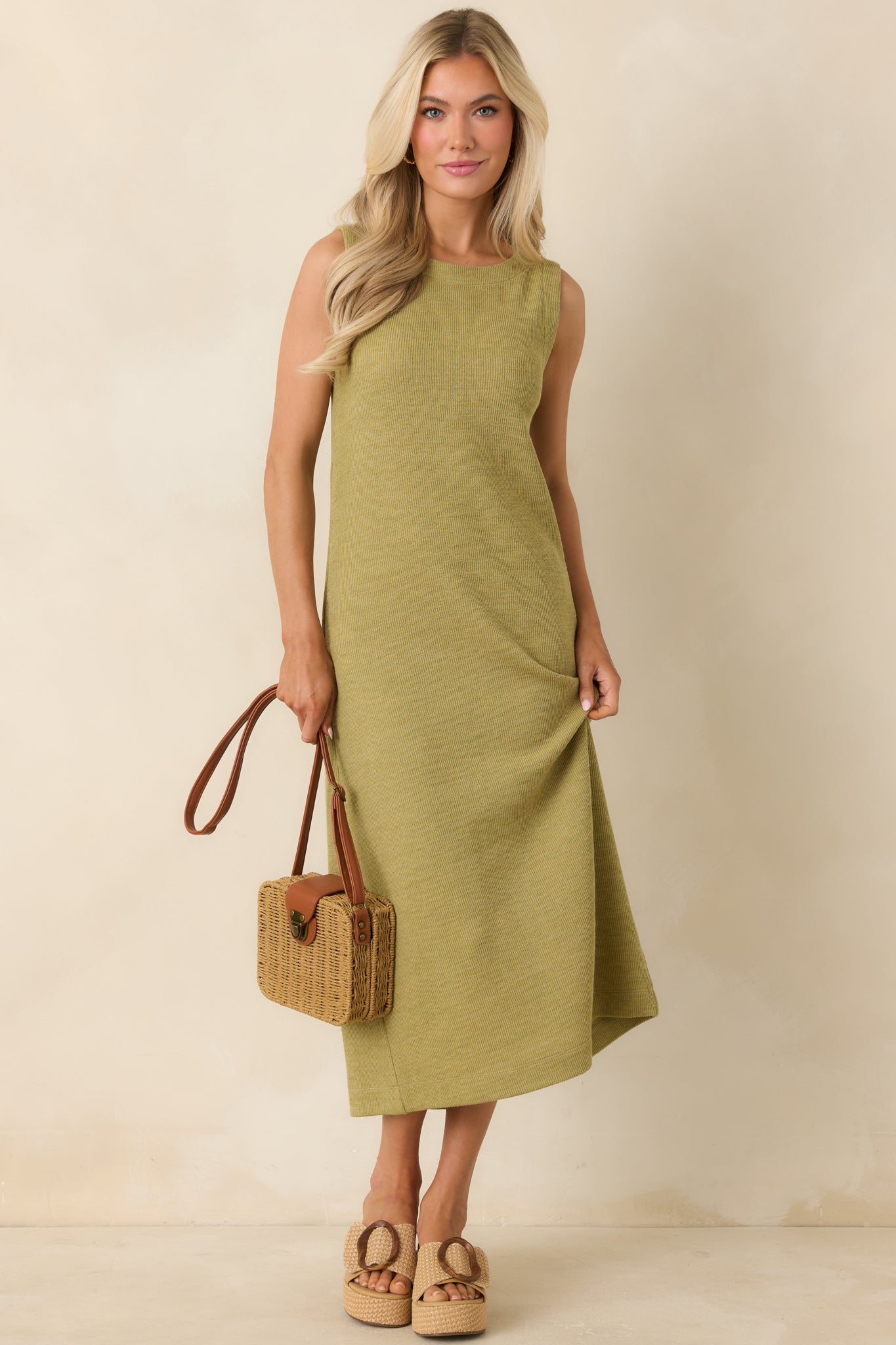 Olive green sleeveless midi dress with a classic round neckline and fitted knit construction.