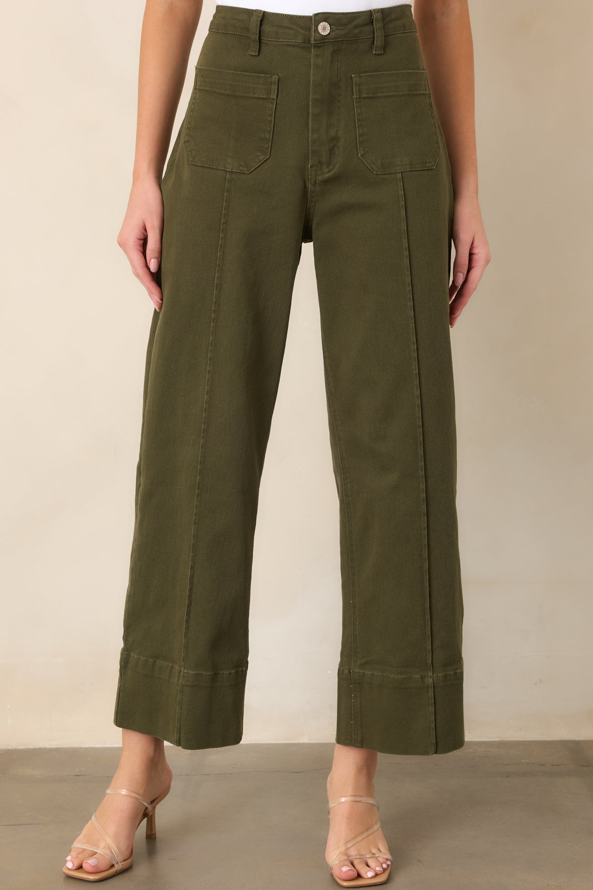Cropped wide-leg pants showcasing pressed center seams and structured wide cuff hems for a polished finish.