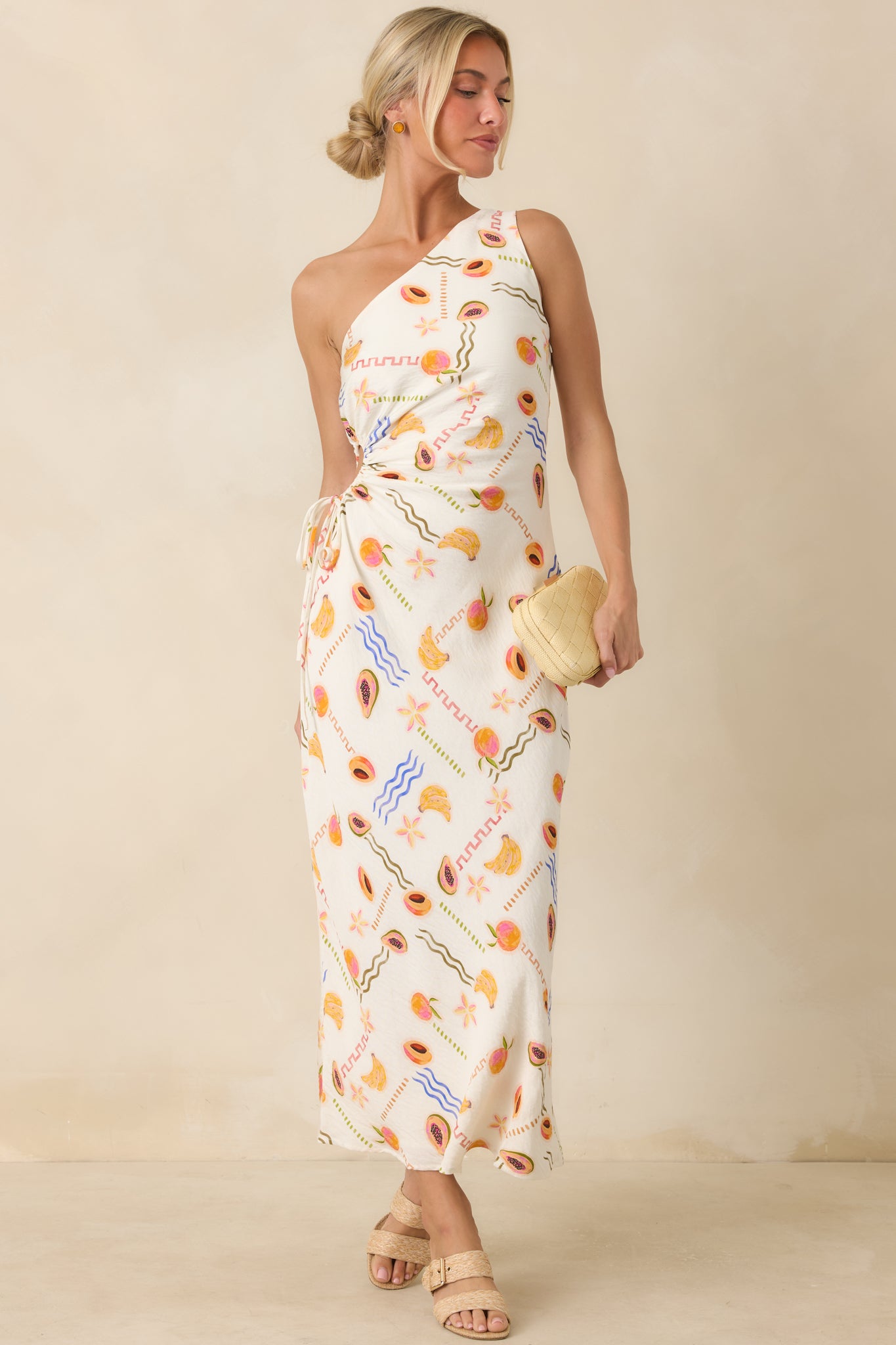 Lightweight printed maxi dress showcasing a one-shoulder design, adjustable drawstring cutout, and full-length flow.