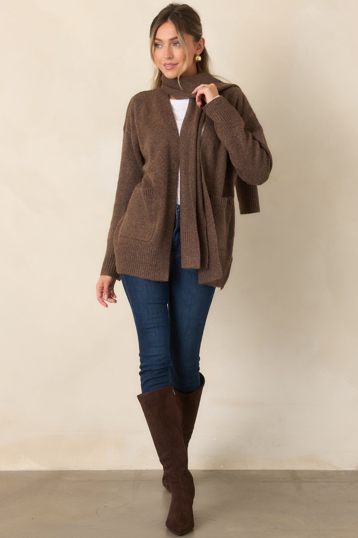 Open-front cardigan showcasing roomy dropped shoulders, long sleeves, and functional patch pockets.